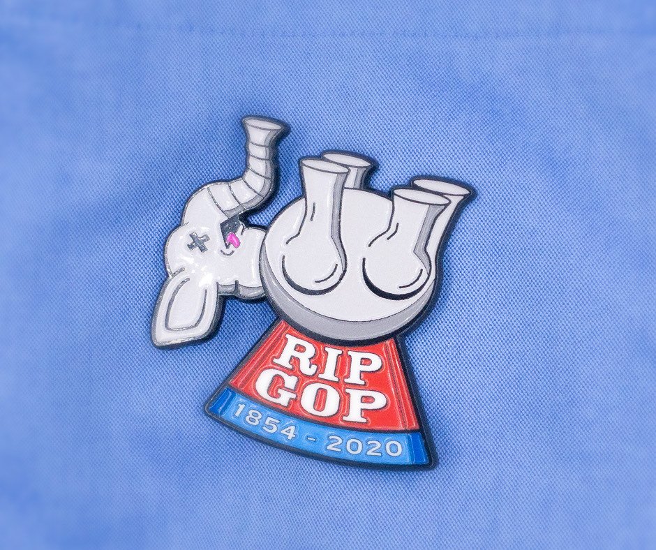 RIP GOP pin worn on a blue button-down shirt